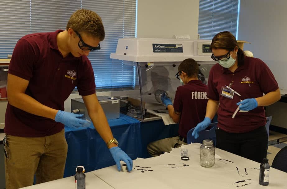 Forensic Investigation Students Work on Lifting Fingerprints