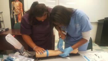 Ma Mlt May 2017 5 - Orlando Medical Assisting And Medical Laboratory Technician Students Work Together - Academics