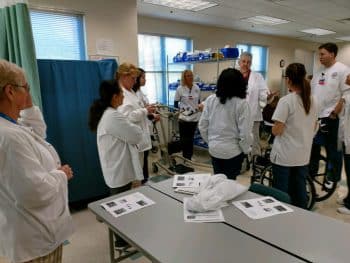 Pta And Nursing Students Train On Effective Patient Care Skills - Nursing Students Train With Pta Students On Patient Care Skills - Academics