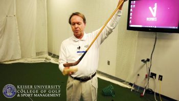 Keiser University College Of Golf Professor Caddies At The Masters Golf Tournament