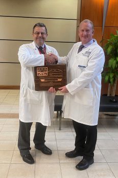 Dr. Ralph Kruse (right) was recently presented a plaque recognizing his election as a Fellow of the International College of Chiropractors by Dr. Michael Wiles, Dean of Keiser University’s College of Chiropractic Medicine.