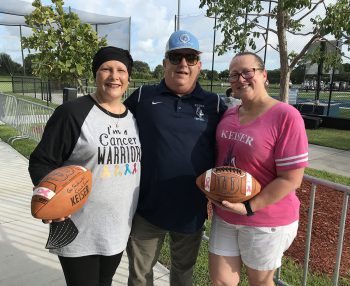 Danielle Foster And Maria Suarez Cantillo With Keiser University Chancellor Dr Arthur Keiser Center - Breast Cancer Awareness: Seahawk Football Team Members Honor Loved Ones On The Field - Featured Articles Danielle Foster and Maria Suarez-Cantillo with Keiser University Chancellor Dr. Arthur Keiser (center)