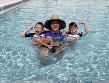 Superhero Swim Academy Coach Jason Siegel With Young Swimmers - Keiser University And Superhero Swim Academy Partner To Support Swim Safety - Community News