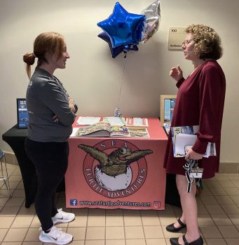 Keiser Professor Dr Robin Schupper Right Shares Insights With A Ku Student - Hawk Talk Presentations Highlight Community Volunteer Opportunities - Academics