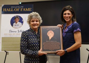 Donna Donna White Is Presented With The S Florida Pga Hall Of Fame Award By Assistant Director Meredith Schuler - Kucog Faculty Member And Lpga/pga Professional Donna White Is Presented With The South Florida Pga Hall Of Fame Award - College Of Golf