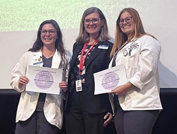 Dr Jennifer Peluso Center With Poster Presentation Third Place College Of Chiropractic Medicine Winners Haelly Ramirez And Jennifer Polak - Research Symposium Unveils Highlights Of Academic Study - Academics