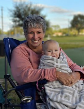 Ashley Payne 039 S Mother In Law Lydiann Mcclure Holding Her Grandson Henley - Women’s History Month: Keiser University Valedictorian And Mom Of Seven Thanks Family Members For Unwavering Support - Graduate Spotlight