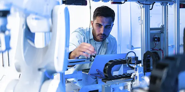 Applied engineering student working on technical projects and mechanical problem-solving