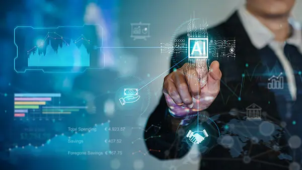 Artificial intelligence BS student coding and testing AI applications in a computer lab