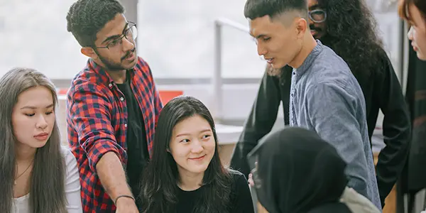 Interdisciplinary studies BS student engaging in diverse academic projects in a classroom