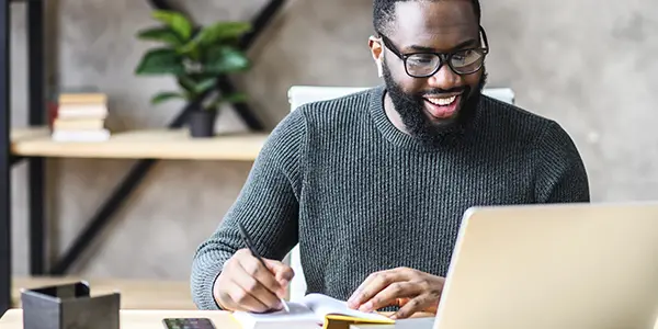 Business student analyzing charts and planning in an office or classroom environment