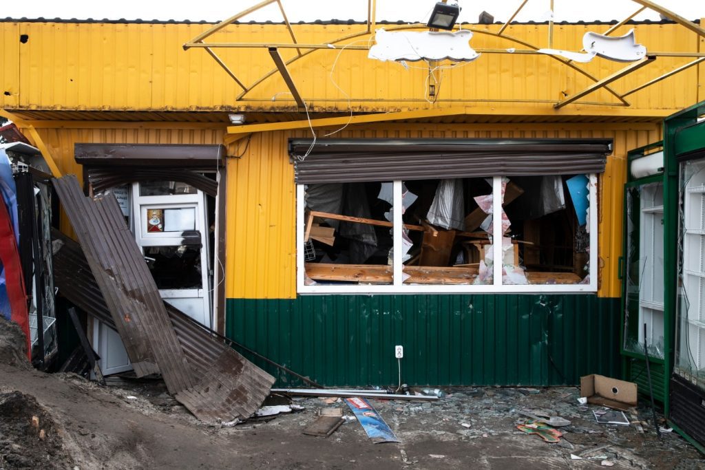 Commercial building with severe structural damage and debris, highlighting the need for disaster recovery planning after unexpected property loss