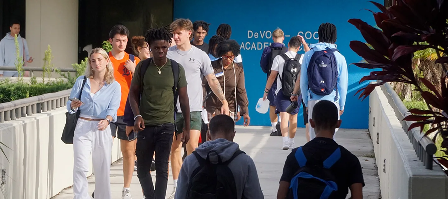 Students walking outdoors on the Keiser University campus.