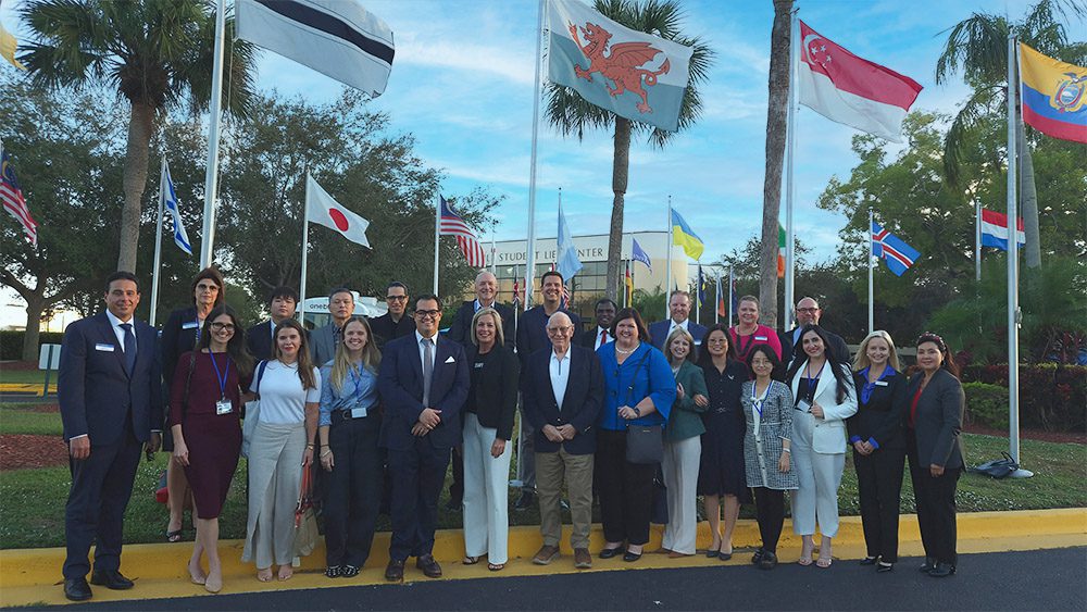 Attendees posing for a photo at the Keiser University World Conference