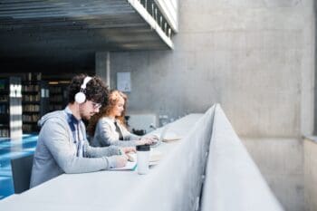 Students reading and studying in a library