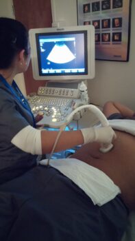 Iralis Carro Performing Diagnostic Medical Sonography