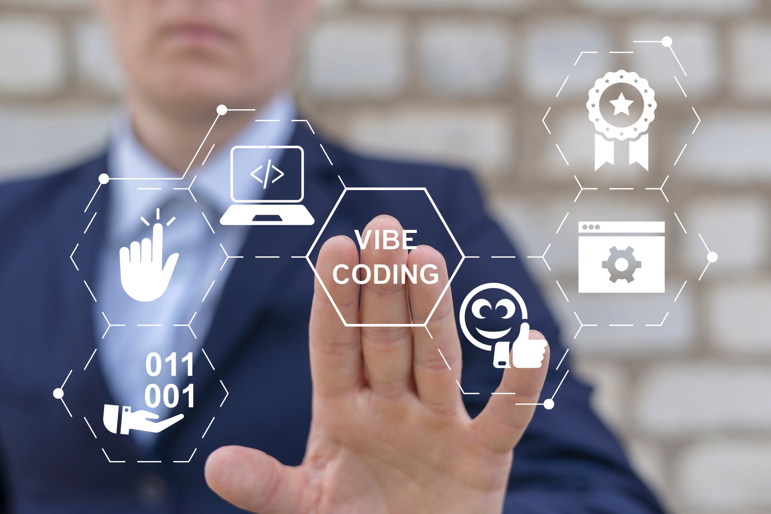 Faculty member using AI-assisted coding technology on a laptop